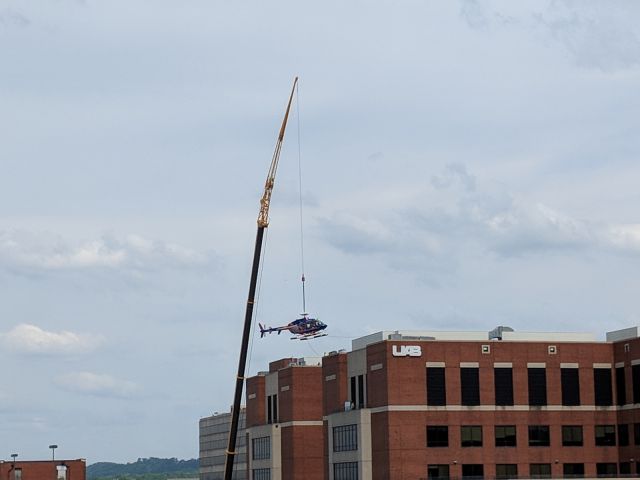 — — - Helo being lifted off the roof of UAB