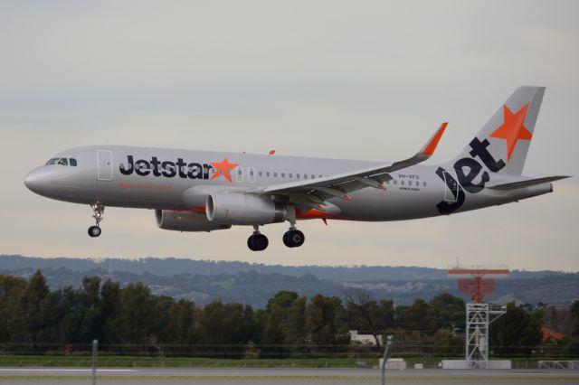 Airbus A320 (VH-VFU) - About to put down on runway 05. Thursday, 19 June 2014.