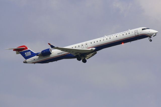 Canadair Regional Jet CRJ-900 (N915FJ) - Mesa/US Air Flight 2647 departs Runway 14 at Sarasota-Bradenton International Airport enroute to Charlotte/Douglas International Airport