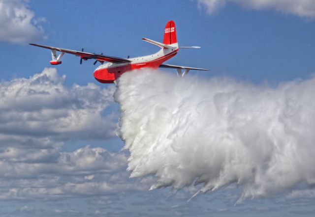 MARTIN Mars (C-FLYL) - Hawaii Mars demonstrating a water drop at the EAA seaplane base near Oshkosh, Wisconsin during AirVenture 2016.