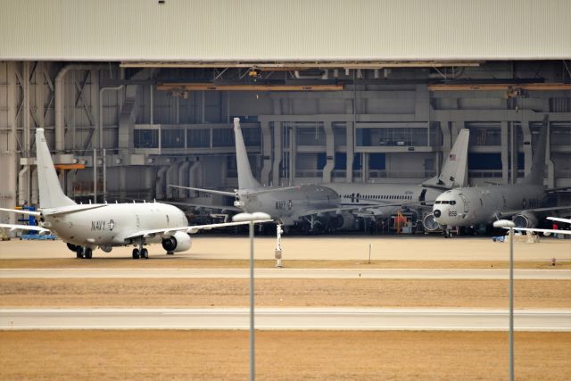 Boeing P-8 Poseidon — - Three P-8's and a Justice Dept 737-400 tucked in the corner there, N279AD