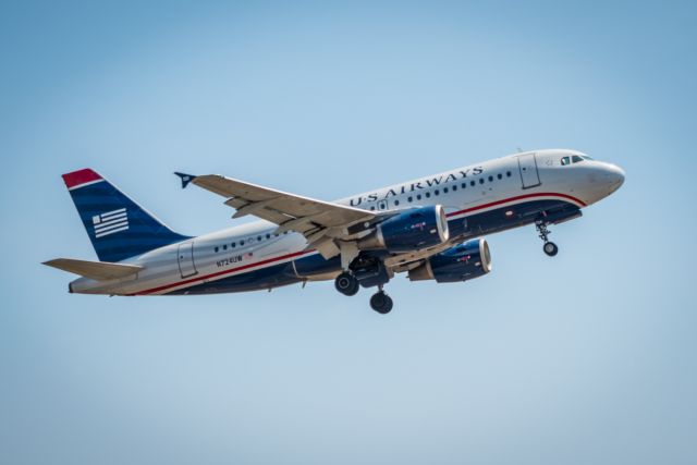 Airbus A319 (N724UW) - Departing runway 10 at Princess Juliana International