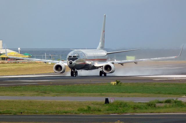 Boeing 737-800 (N951AA) - Astrojet roars down the runway after a light rain shower