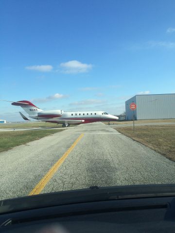 Cessna Citation X (N2AZ) - Taken at intersection of E taxiway and sevice vehicle corridor. 