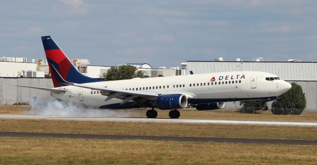 Boeing 737-800 (N3766) - Main gear strike as a Boeing 737-8 touches down on Runway 18L at Carl T. Jones Field, Huntsville International Airport, AL - October 3, 2016.