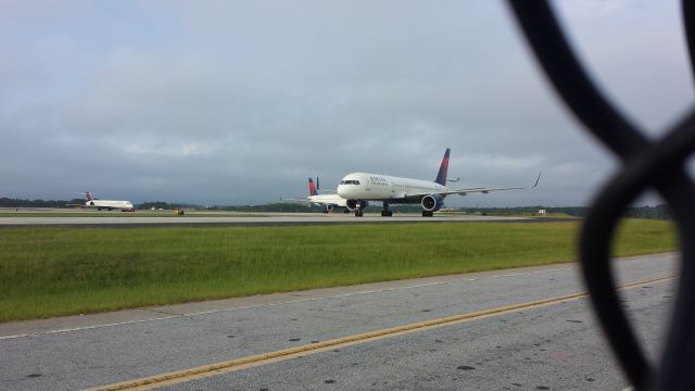 Boeing 757-200 (N556NW) - TAKEN FROM THE SOUTH TERMINAL CELL PHONE WAITING LOT
