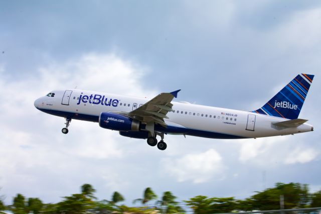 Airbus A320 (N804JB) - Smartly liveried Jet Blue A320 lifting off from Rwy 10 in Sint Maarten - Jan 4, 2013