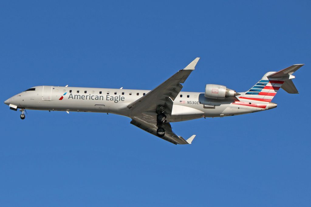 Canadair Regional Jet CRJ-700 (N530EA) - ENY3510, a Canadair CL-600-2C10 Regional Jet CRJ-702 (N530EA, c/n 10308), on short final for RWY 24R on a sunny autumn morning.