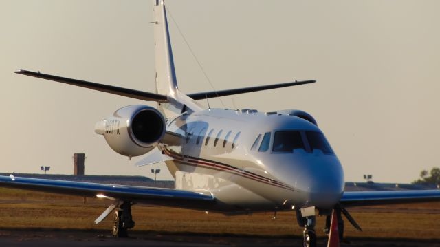 Cessna Citation Excel/XLS (N607TX) - Sitting on the Atlantic ramp during a Friday evening sunset.