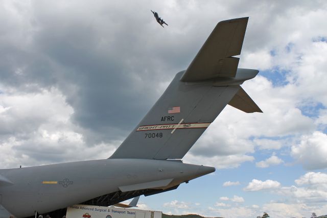 Lockheed C-130 Hercules (92-3288) - A USAF Lockheed C-130H, cn 382-5353, from the 934th Airlift Wing, Flying Vikings, Minneapolis, MN, circling overhead as a C-17A (97-0048) is offloaded at Young Air Assault Strip during Warrior Exercise 86-13-01 (WAREX) on 26 Jul 2013.