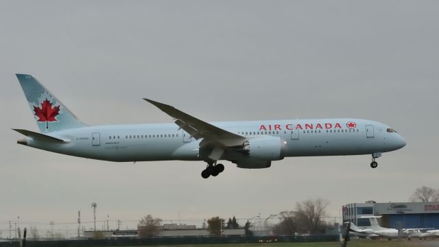 Boeing 787-9 Dreamliner (C-FNOG) - Landing as heavy rain starts falling.