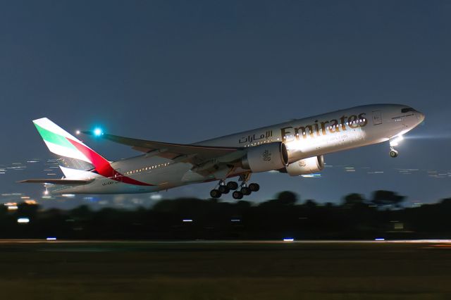 BOEING 777-200LR (A6-EWH) - Departing off Rw 23 operating Emirates flight EK441 to Dubai Friday April 25, 2025.