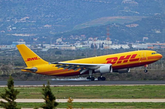 Airbus A300F4-600 (D-AEAJ) - DHL A300 burning rubber after touching down in Athens Intl Airport early in the morning.