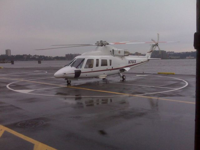 N76XX — - Sikorsky S-76B at Mahattans West 30th Street heliport Aug. 10, 2008. Aircraft is about to depart after dropping off a passenger. Photo taken by Blackberry 8310 with a 2 megapixel camera.