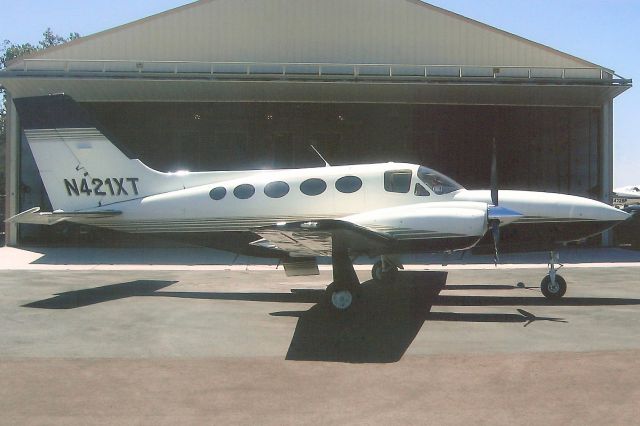 Cessna 421 (N421XT) - Seen here in Aug-06.