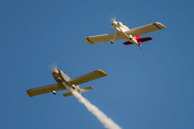 Vans RV-4 (N474JB) - N905RK throwing some smoke with N474JB