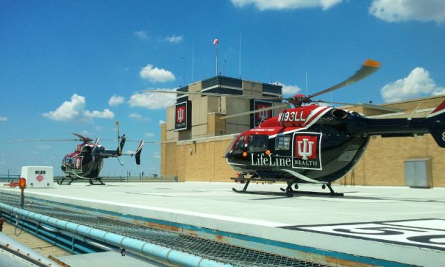 KAWASAKI EC-145 (N193LL) - N193LL flying as LifeLine 4 (foreground) and N197LL flying as LifeLine 3 prepare to depart Indiana University Health Methodist Hospital helipad after restocking/refueling following a dual scene flight in June 2012.  Photo by EJ Claflin, FP-C