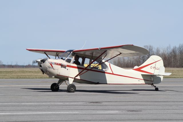 CHAMPION Tri-Traveler (C-FLLU) - Well-maintained 1946 Aeronca Champ prepares for departure from Kingston Airport on a bright, but cool day..