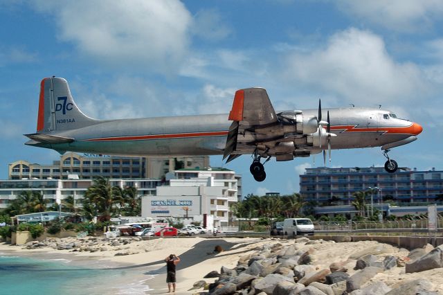 Douglas DC-7 (N381AA) - 1956 version skimming the fence with a lot of flap!