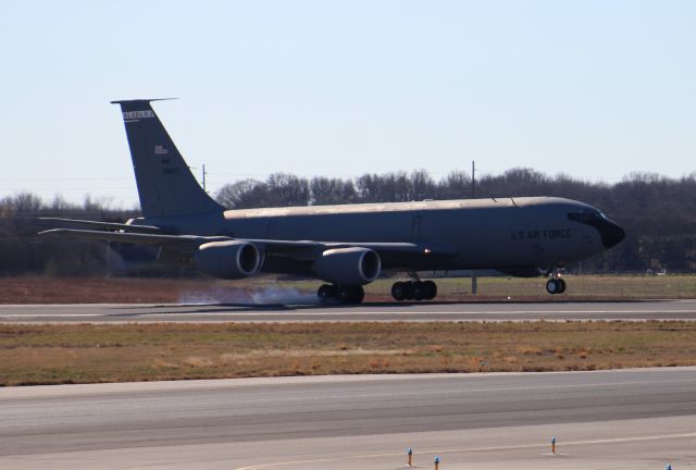 ANG38007 — - A KC-135 Stratotanker at right main gear touchdown on Runway 36L during a series of touch and gos at Carl T. Jones Field, Huntsville International Airport, AL - December 30, 2016. As you can tell the sun was above and behind this jet in this particular photo (backlit). Shot with a Canon T5 in sports mode with a 75mm-300mm lens from outside the taxiway perimeter fence along West Boeing Road.