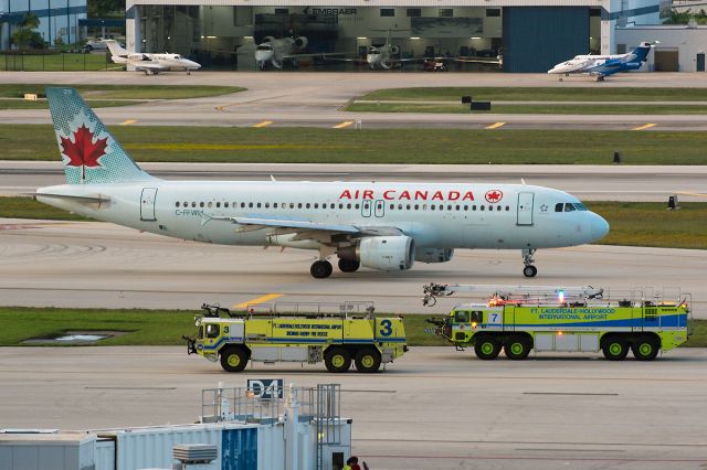 Airbus A320 (C-FFWM) - Gratifyingly unspectacular flight conclusion for ACA932, shown here paused on the high speed taxiway at KFLL for brake inspection before parking.  Inbound Montreal flight had earlier declared PAN for control issues.  Track here: a rel=nofollow href=http://flightaware.com/live/flight/ACA932http://flightaware.com/live/flight/ACA932/a