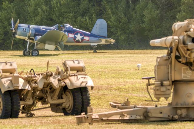 VOUGHT-SIKORSKY V-166 Corsair (N46RL) - Flak 37 88mm gun gets the attention of Vought FG1D Goodyear manufactured Corsair at Warbirds Over the Beach 2021, October 2nd and 3rd. The Corsair flew both days and the Flak 37 was fired three to six times both days. Great airshow.