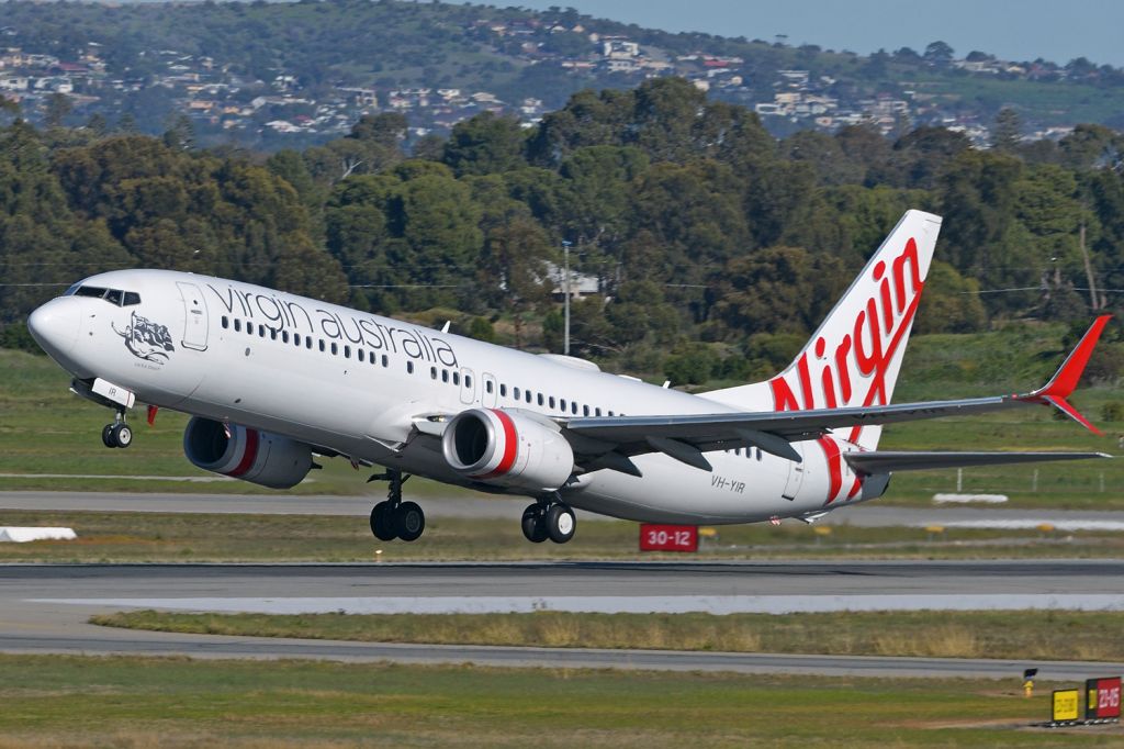 Boeing 737-800 (VH-YIR) - Departing off runway 05, Adelaide, South Australia, July 17, 2020 - viewed from inside the terminal.br /br /This was my first look at a Virgin B738 with the new winglets. At this time, I believe there are three refitted so far.