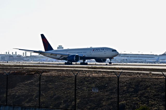 Boeing 777-200 (N710DN) - Just touching down on 24R after a long haul from Tokyo NRT.