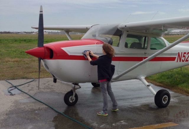 — — - Helping Dad wash an airplane.