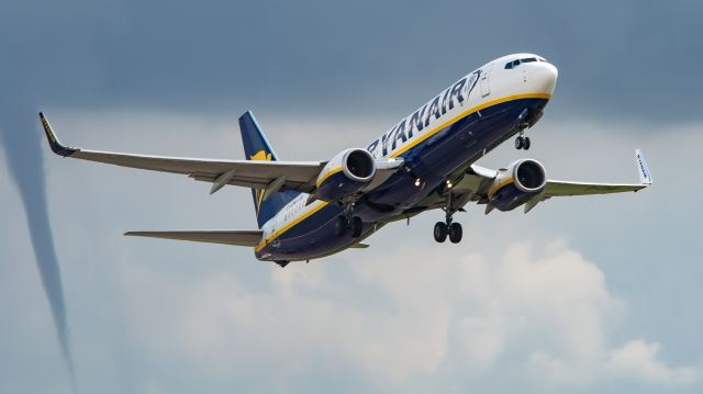 Boeing 737-800 (EI-EMN) - "Leaving the weather behind" br /br /Ryanair takes to the skies heading for warmer climes with a funnel cloud in the background. 