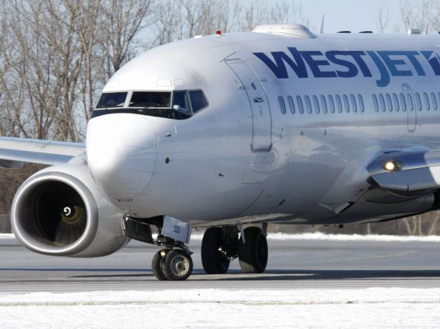 Boeing 737-700 (C-FWSV) - Taxiing to position on Rwy 25