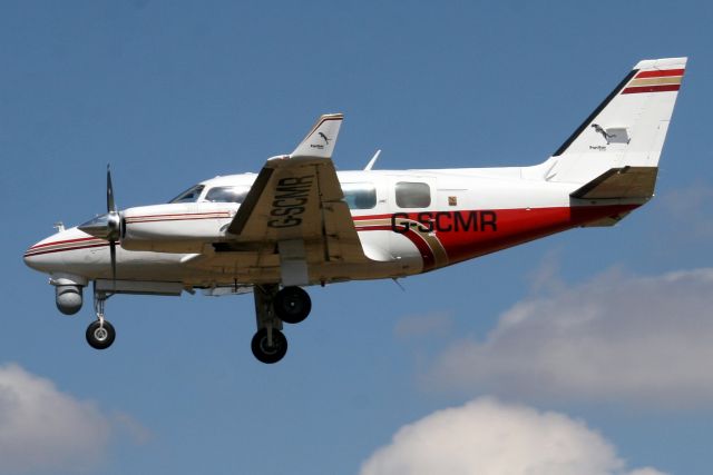 Piper Navajo (G-SCMR) - On short finals for rwy 25 on 23-Jul-18.