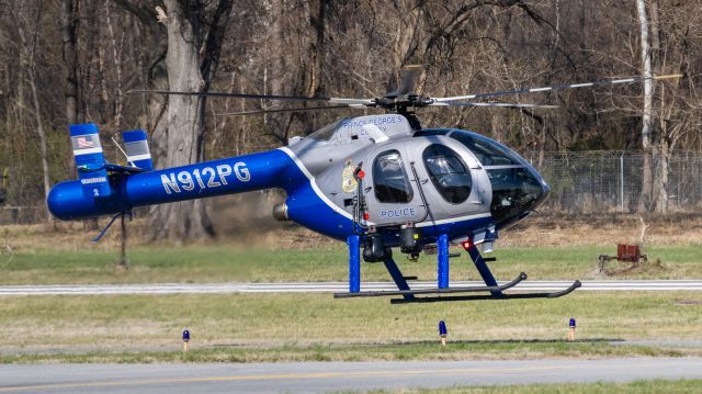 MD HELICOPTERS MD-520N (N912PG) - An MD520 helicopter owned by PGPD hover-taxiing to College Park Airport's runway 15