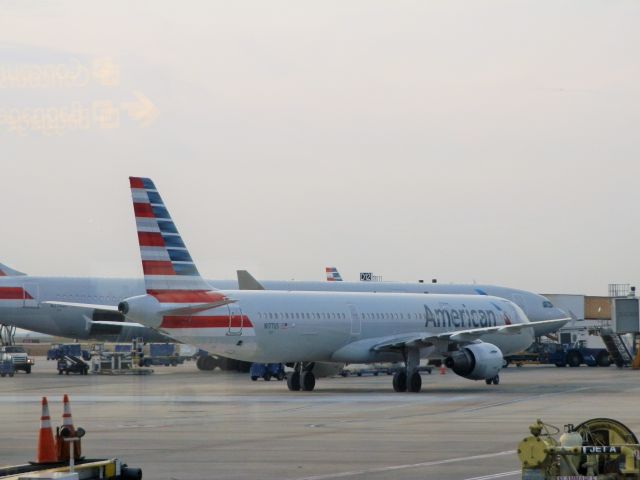 Airbus A321 (N177US) - Alongside An American A330-300