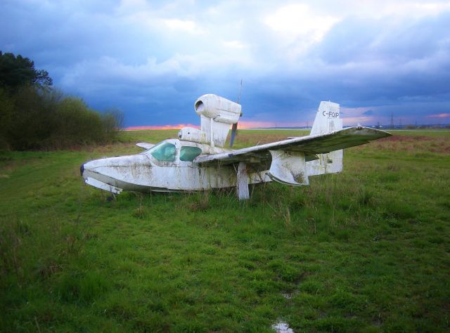 C-FQIP — - This Lake Buccaneer flew in from Canada and has never left. She resides under a stormy sky in the weeds at Elstree Aerodrome, England