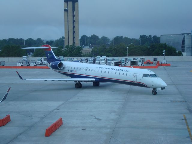 Canadair Regional Jet CRJ-700 (N703PS) - N703PS taxiing off of E28 in CLT