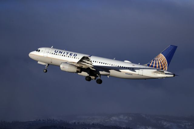 N460UA — - A United A-320 departing Reno-Tahoe International RWY 17R catches a last glint of morning sun as a snow storm approaches.