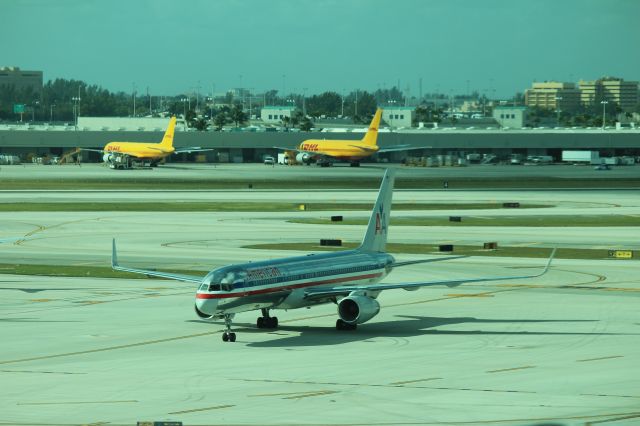 Boeing 757-200 (N630AA) - 121013 taxiing in to Term D southside from Rwy 9.DHL B752F and B762F at Cargo City