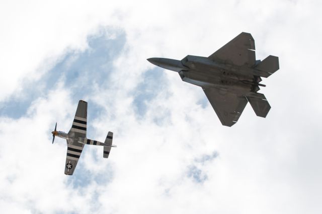 North American P-51 Mustang — - P-51 Heritage Flight with the F-22 Demo Team at Westover Air Reserve Base in Chicopee, Massachusetts.