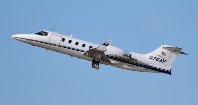 Learjet 31 (N70AY) - This Learjet pulled off a very early rotation off of 23R - spotted from the RDU observation deck, 11/18/18.