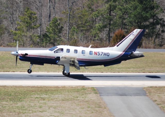 Socata TBM-700 (N57HQ) - BRAVO HOTEL AVIATION INC arriving runway 20 at KJQF - 3/14/14