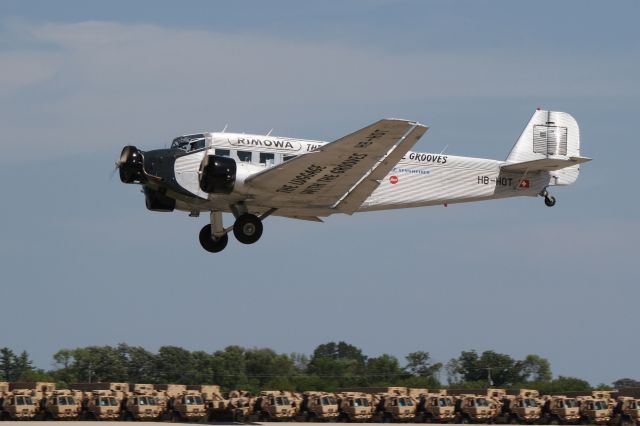 JUNKERS Ju-52/3m (HB-HOT) - A truly vintage Ju52 Tante Ju sponsored by luggage makers Rimowa displaying at Airventure 2012.  The pilot, a Lufthansa Captain, was reprimanded by the air boss for making over-tight turns and exceeding his time allowance..