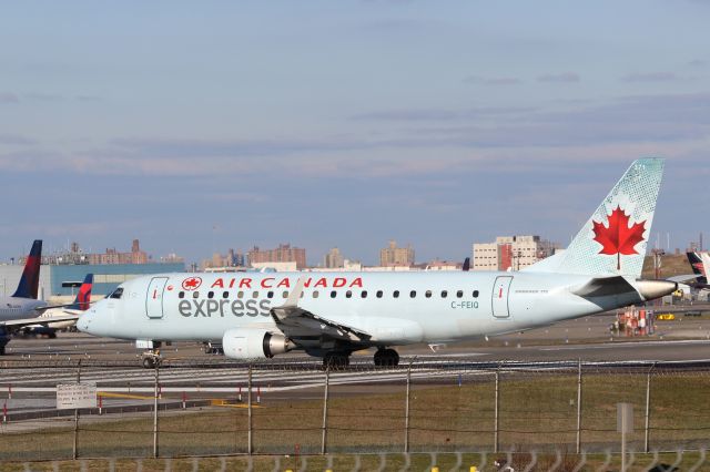 Embraer 175 (C-FEIQ) - New York LaGuardia (LGA). Air Canada Express / Sky Regional flight AC7637 / RS7637 taxis for departure to Montreal Trudeau (YUL).br /Taken from Planeview Park, 23rd Avenue at the end of Runway 4/22br /2017 12 01  a rel=nofollow href=http://alphayankee.smugmug.com/https://alphayankee.smugmug.com//a