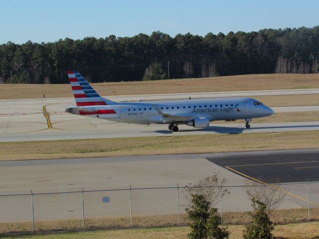 Embraer 170/175 (N137HQ) - American Eagle (Republic Airlines) flight 4512 to Philadelphia Intl, an Embraer 175 taxiing to takeoff on runway 23R. This was taken January 30, 2016 at 4:05 PM.