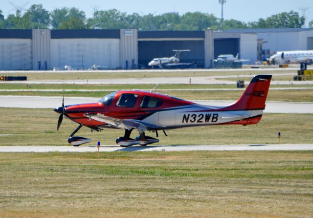 Cirrus SR-22 (N32WB) - N32WB, a Cirrus SR22 G6, exiting runway 12 after arriving in Chicago Executive, taken from the viewing area.