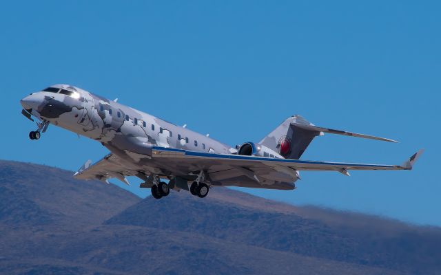 Bombardier Global Express (N2T) - This is the only departure photo of N2T I got with the mountains included.