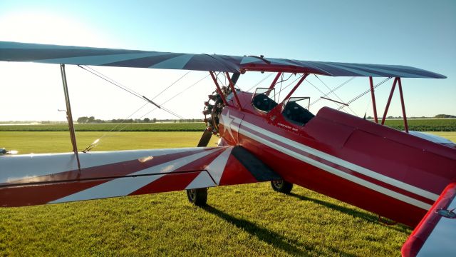 N75808 — - Stearman gleaming in the evening sun at Rainbow Ranch.