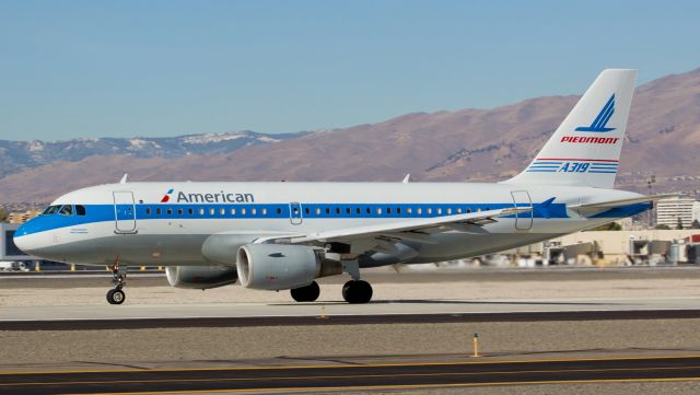 Airbus A319 (N744P) - AALs N744P, the Piedmont heritage special livery A319 that recently emerged from the paint shop displaying the "American" title instead of the former "US Airways" nameplate, accelerates down runway 16L to begin a delayed departure to KPHX.  I caught it rotating just a few seconds later, but this snap shows the new "American" brand better.