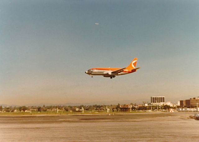 Boeing 737-700 — - CP AIR B-737 landing at KLAX spring 1977. Above the 737 there is another airplane on downwind for landing. Looks like a B-747.