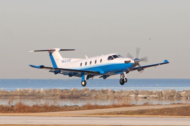 Pilatus PC-12 (N622AF) - CNS568 ready for an early morning departure on RWY 6L amidst a scenic Cleveland/Lake Erie backdrop. Cobalt Air 568 was en route to Cincinnati Muni (KLUK). 